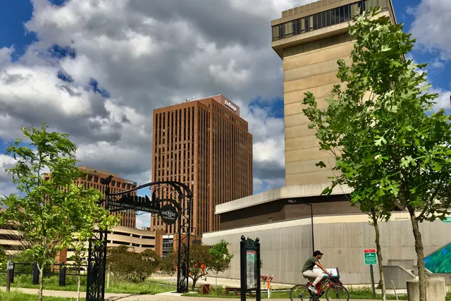The Ohio and Erie Canalway towpath in downtown Akron with tall buildings behind