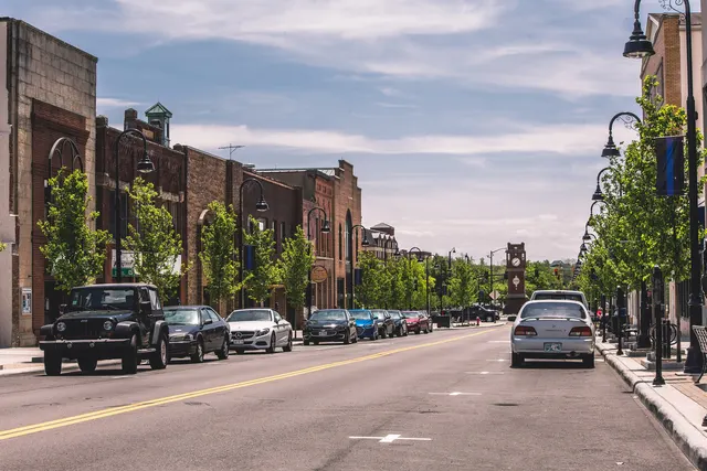 Front Street in downtown Cuyahoga Falls with brick buildings and street lamps